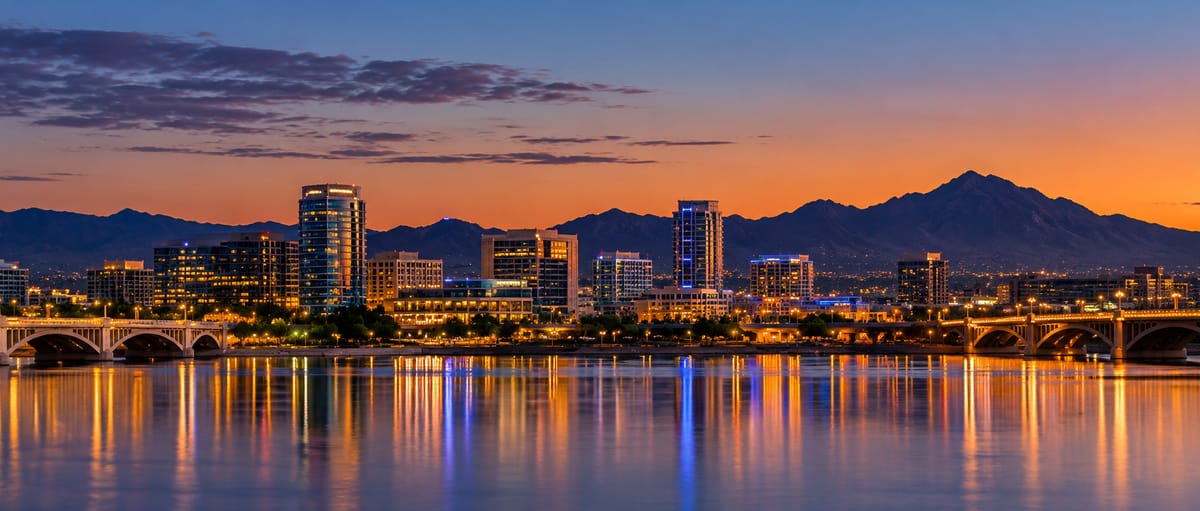 Tempe, Arizona skyline over Tempe Town Lake at dusk